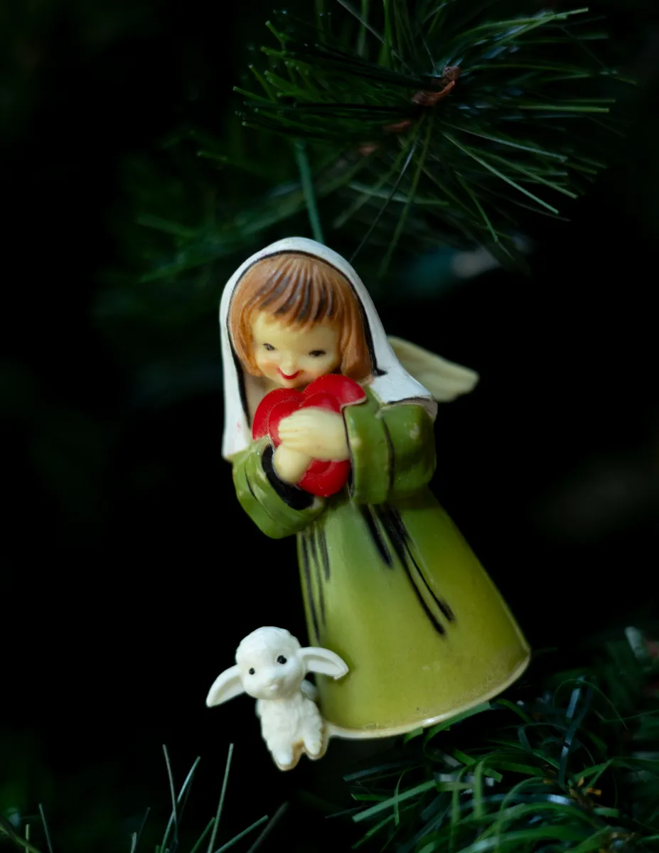 Christmas Tree Ornament: Cherub Little Girl Holding a large red heart, in a green dress standing next to a lamb