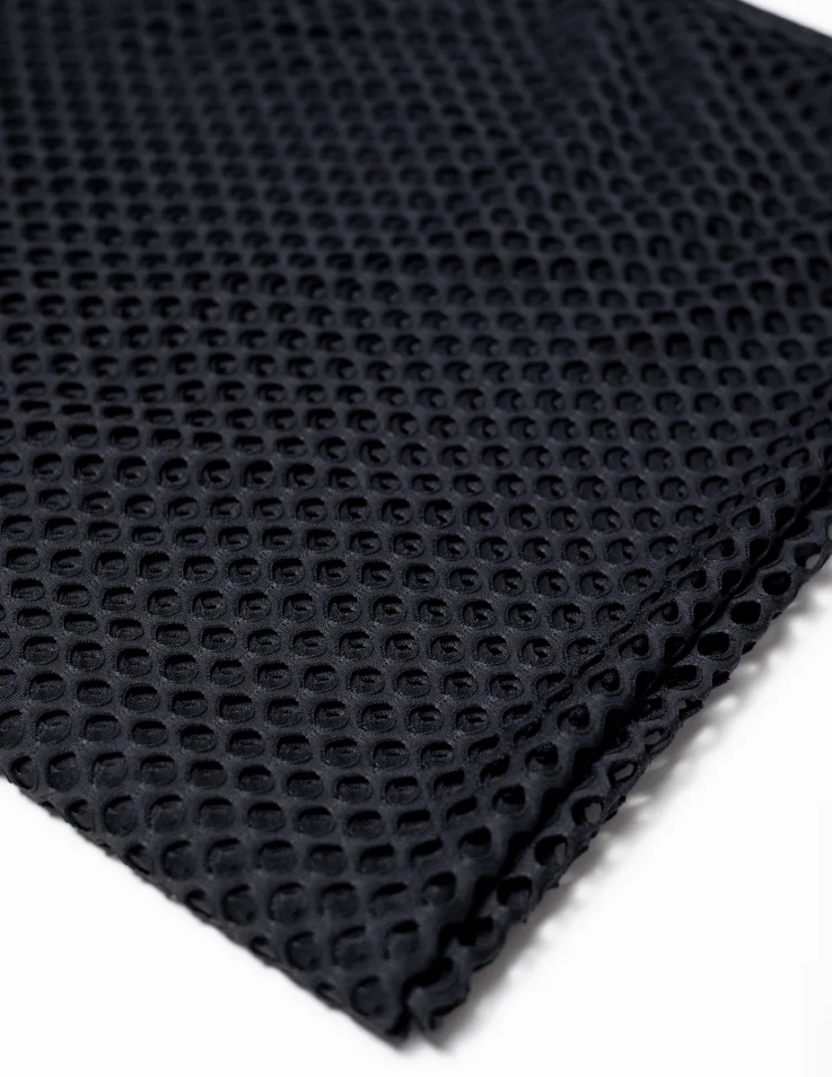 Fabric: Black Mesh 1980s Jersey Fabric with Oval Holes like Fishnet stockings