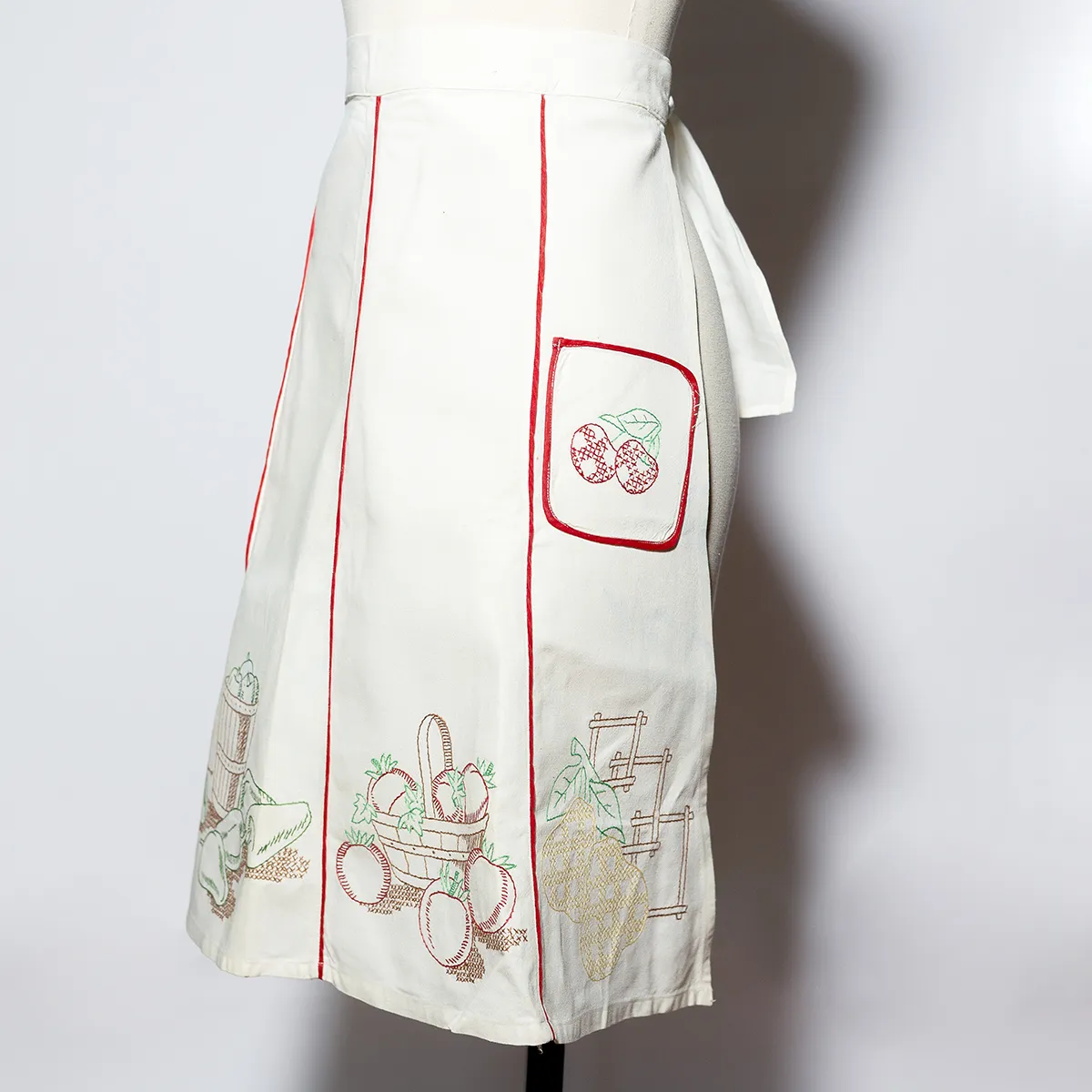 Kitchen Soft Goods: Hand Made Vintage Kitchen Apron small starched white fabric with hand cross stitched fruit and vegetables, red edging - 45" around 23.5" long