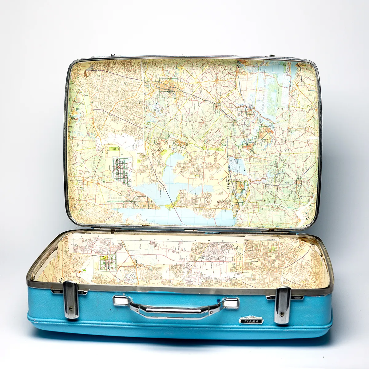 Shiny Baby Blue American Tourister Tiara Suitcase with Paper Machette Map lining the interior
