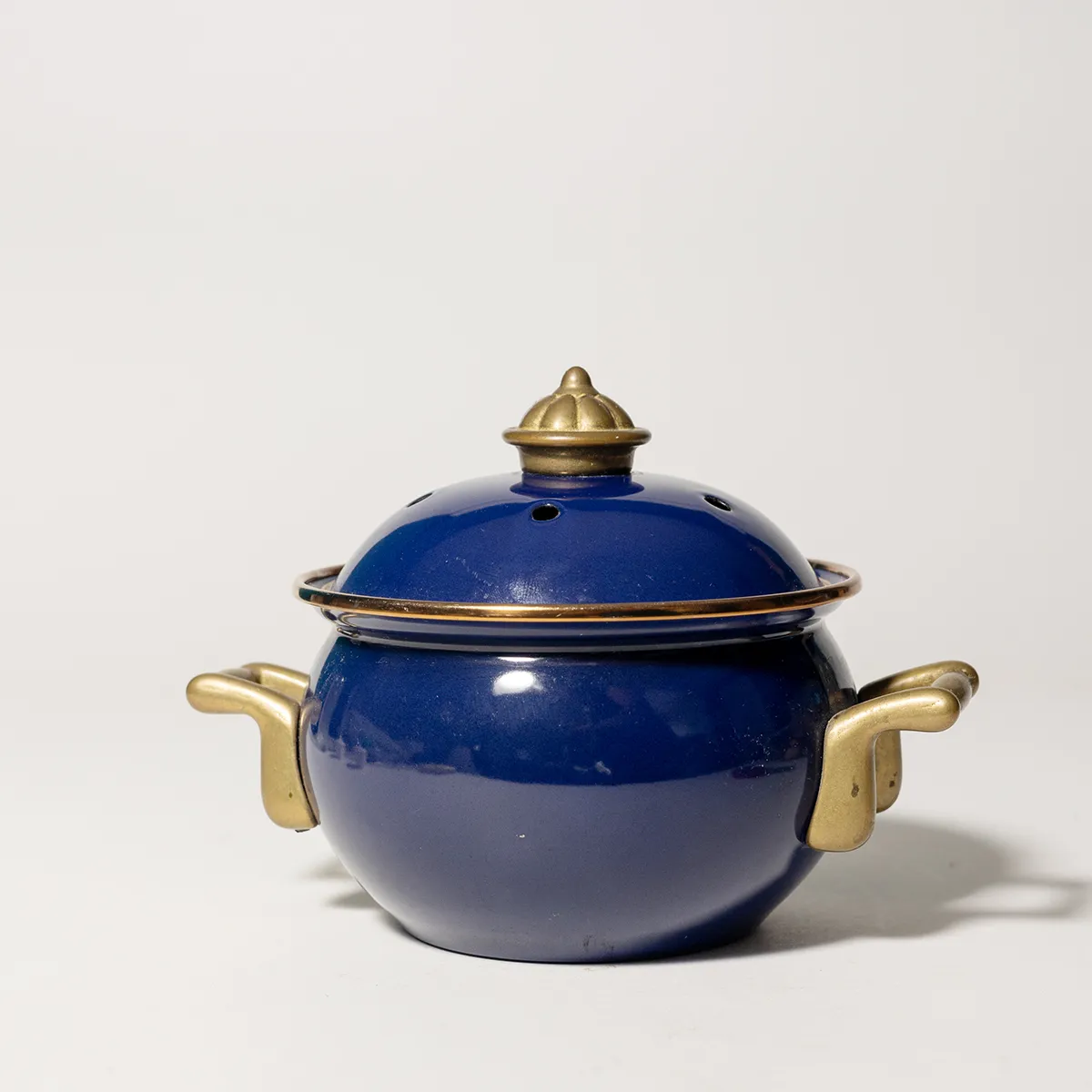 Royal Blue and Gold a Garlice Roasting pot. 2 gold Handles and scalloped handle on the lid