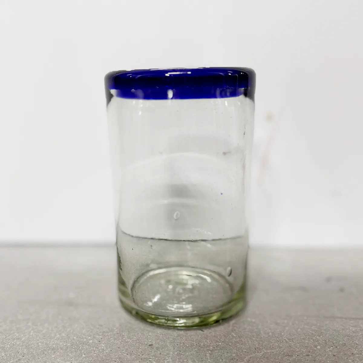hand-blown glass with a distinctive cobalt blue rim