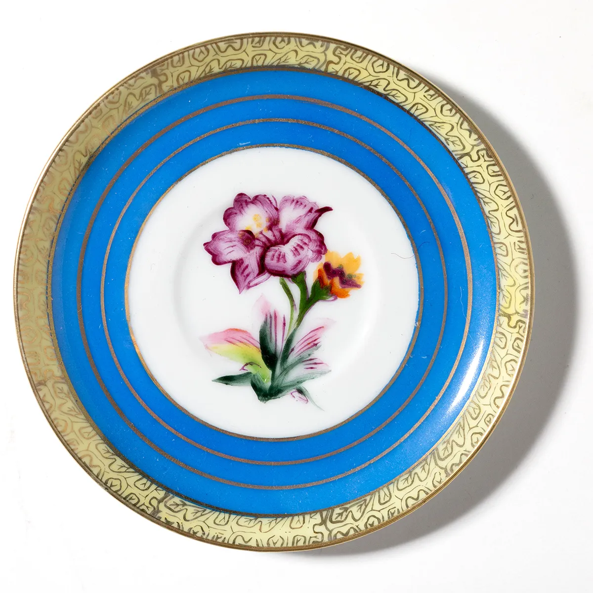 Indigo Hand Painted Rim with Gold Hand Painted Purple Flower in the center of the center