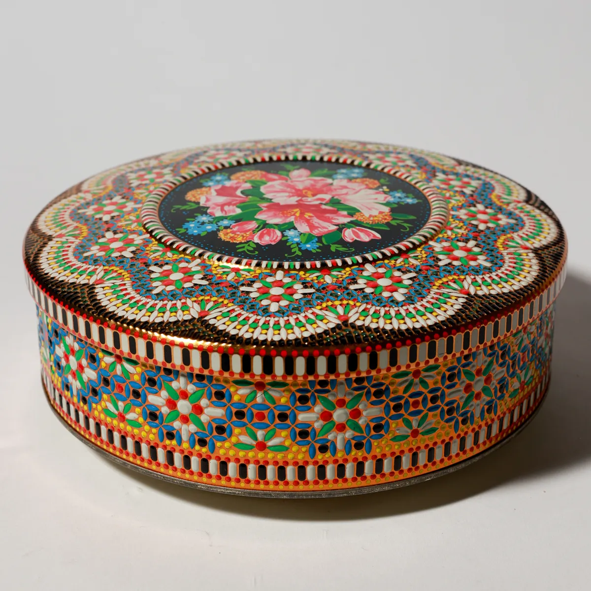 Cookie Tin Black with Pink Flowers in the Middle and Scalloped Edge Design