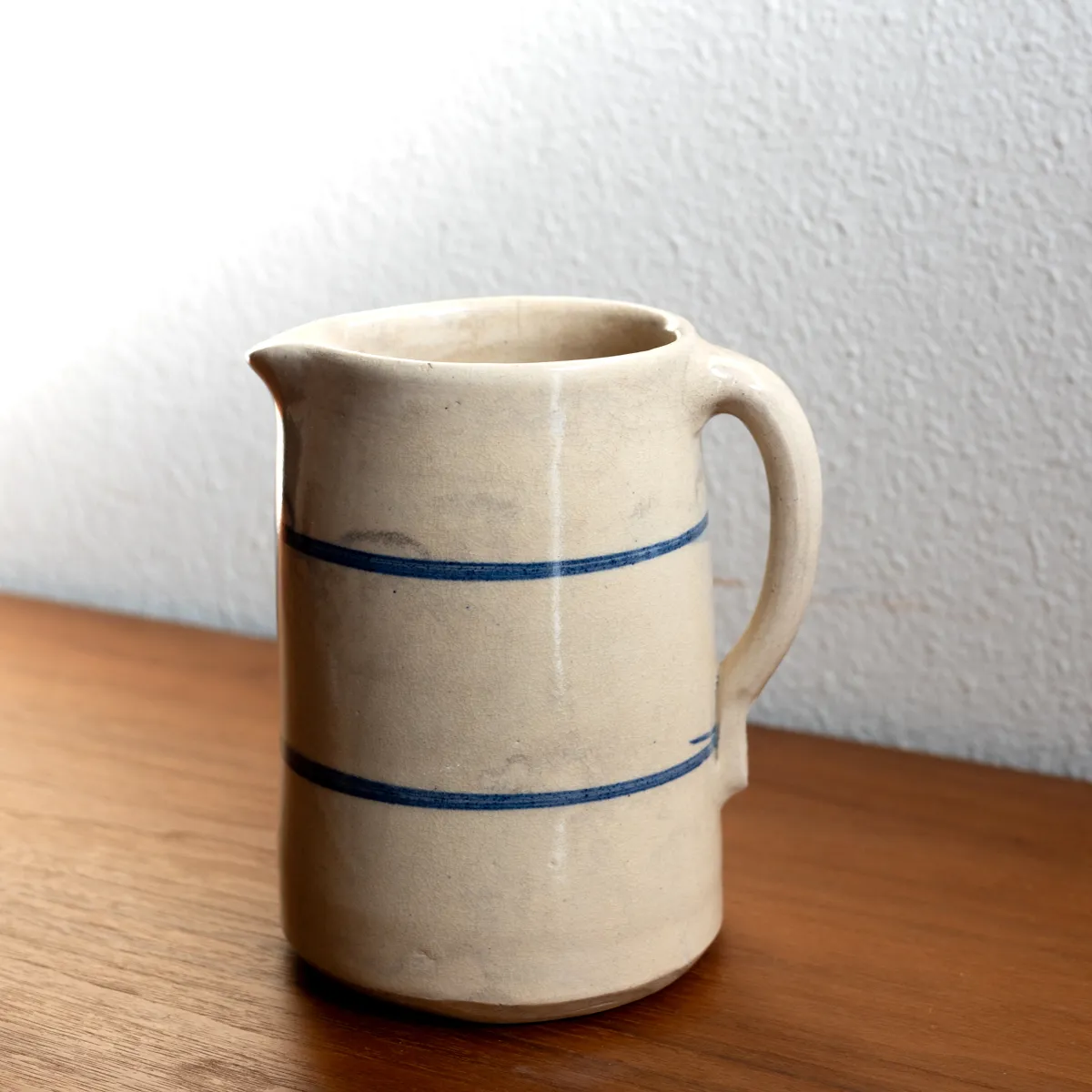 Vintage Ceramic Water Pitcher Cream Colored with two blue lines 