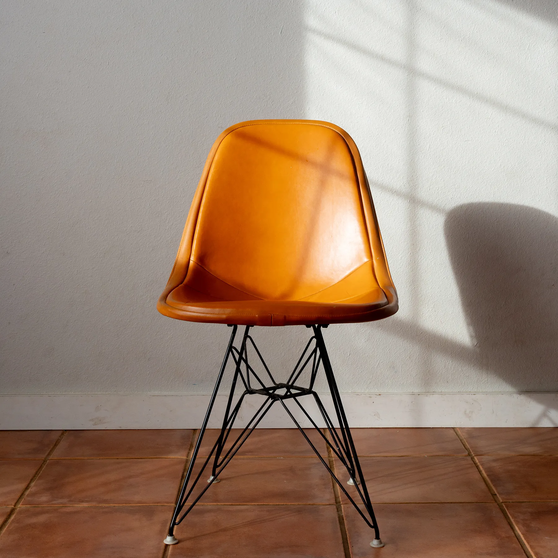Vintage Pumpkin Orange Leather Original Earmes Chair