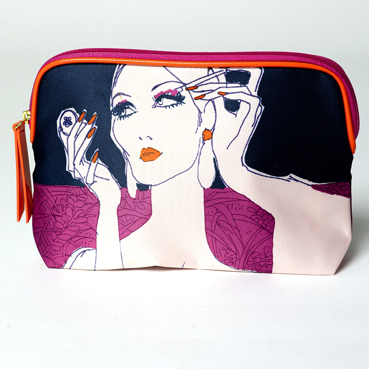 Estee Lauder Pink, Black and Orange Make-up bag with an illustration of a woman fixing her hair