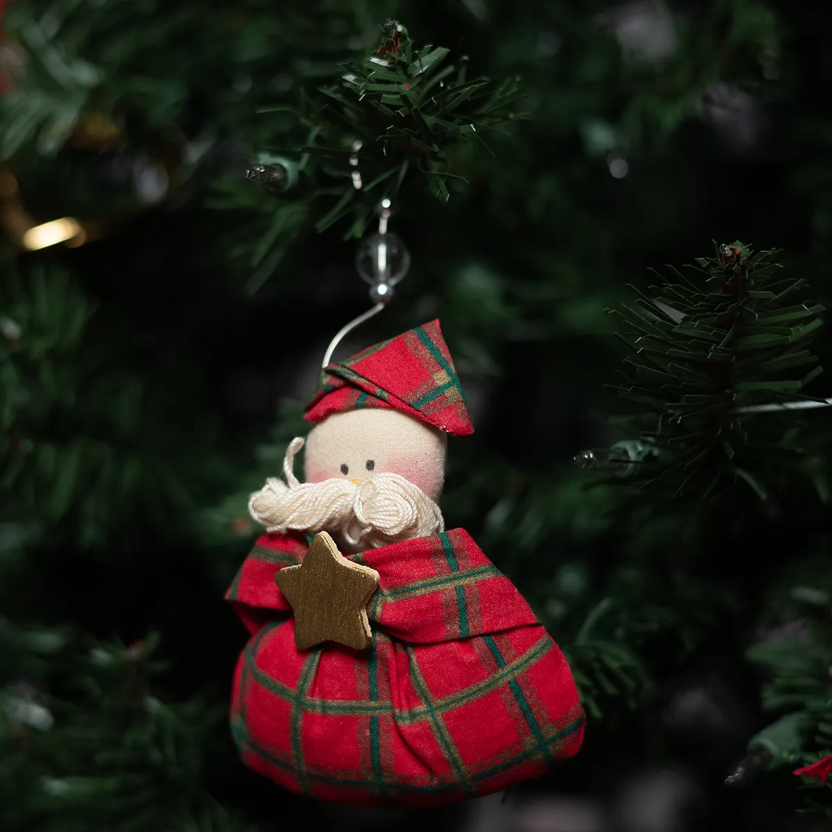 Santa Clause Wearing his Plaid Pajamas holding a gold star. hand made