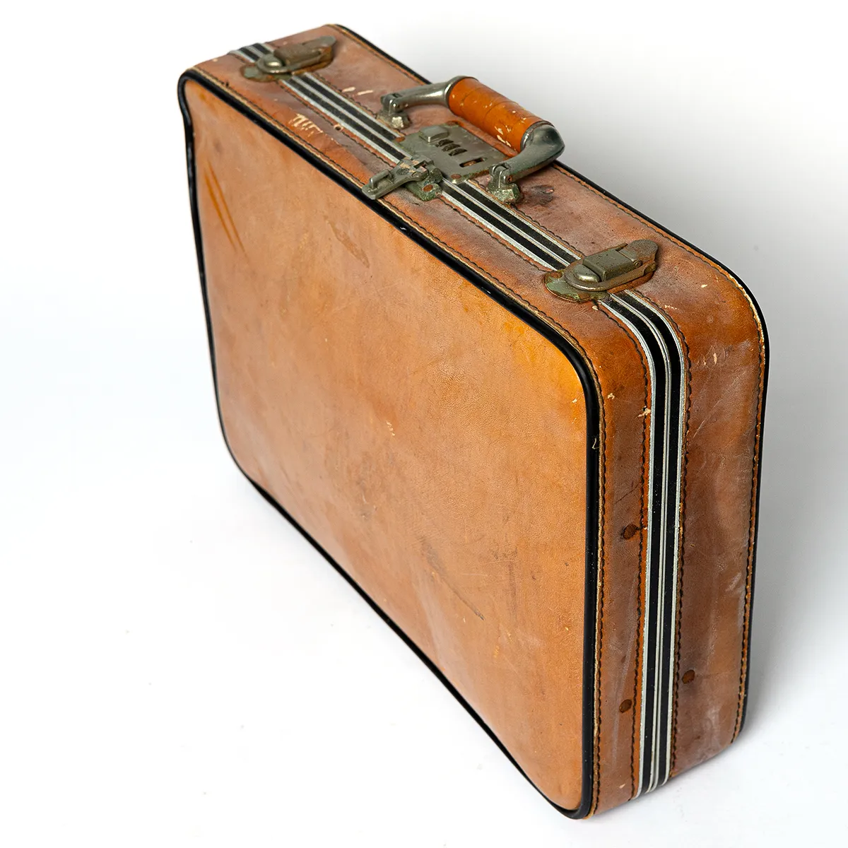 Vintage leather camel colored with black piping, and black metal closure around the outside silver buckles and metal handle Vintage 1900s Wood Suit Case Carpet Bagger Suitcase Train Car Baggage