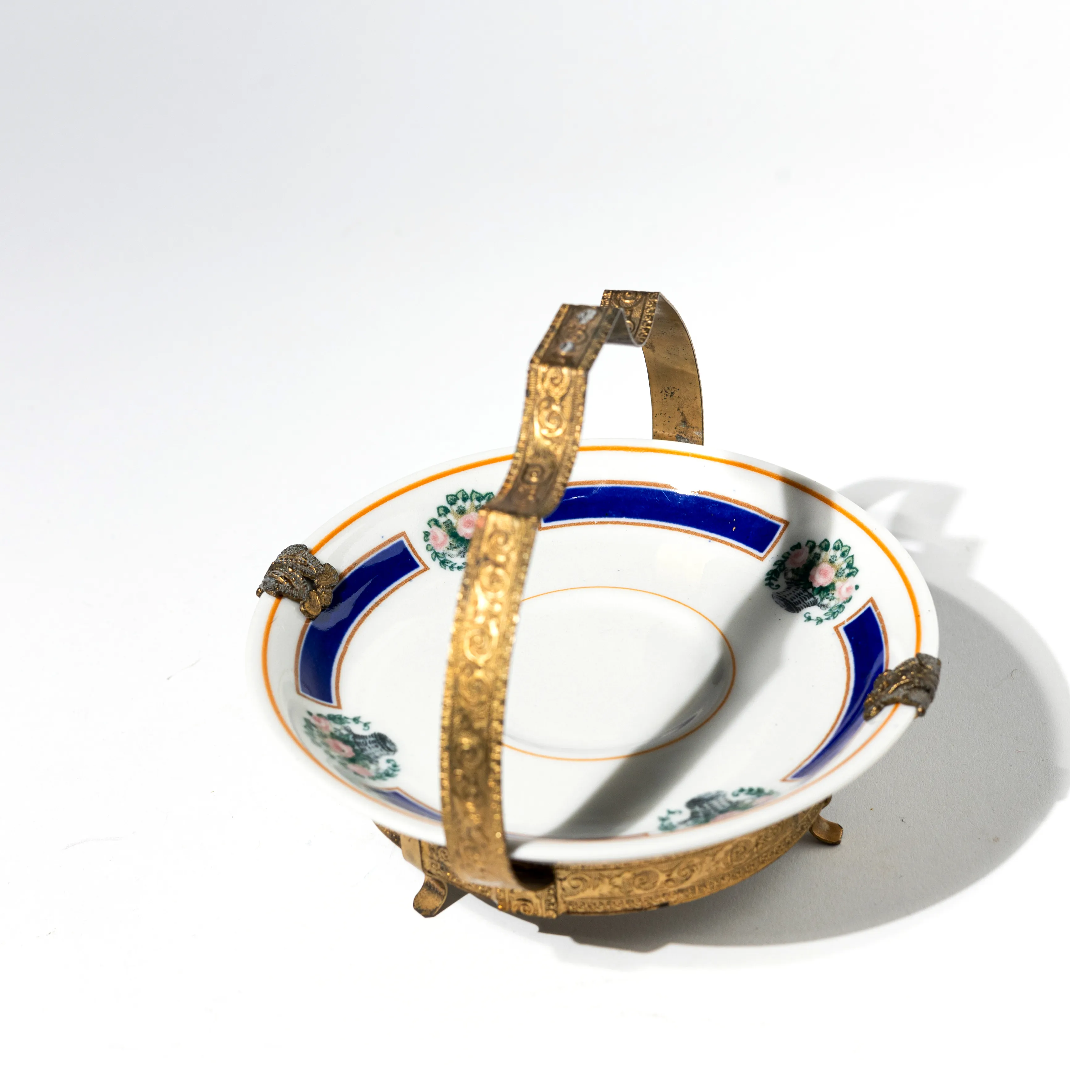 Bon Bon Dish with Royal Blue Border and Pink Flower Bouquet atop a gold pedestal and handle