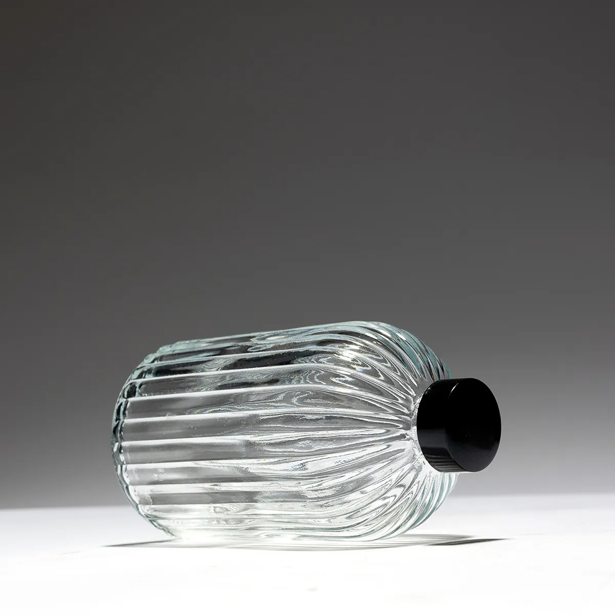 Small Clear Ribbed Glass Decanter with black plastic lid -  5.5" x 3"