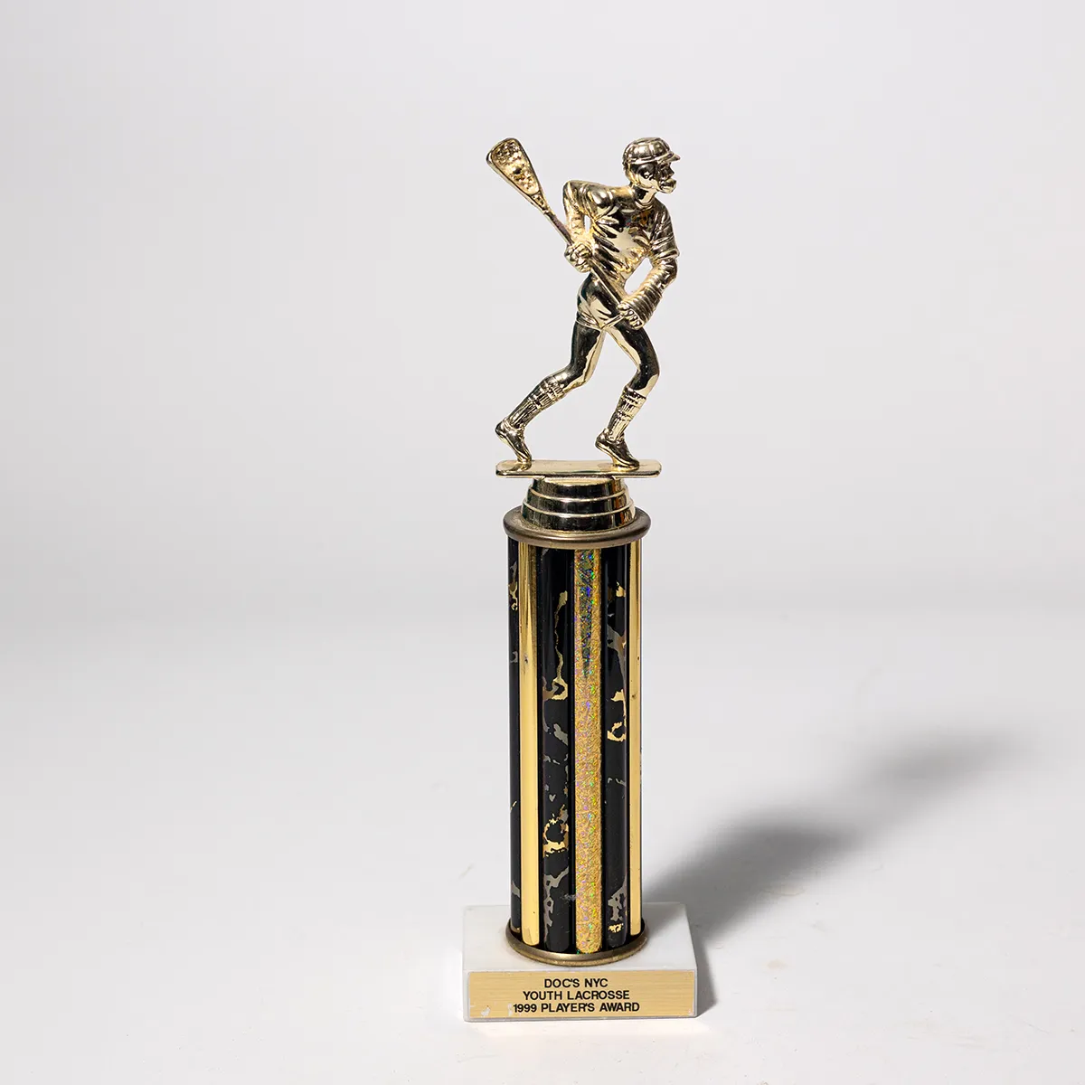 black and gold lacrosse trophy