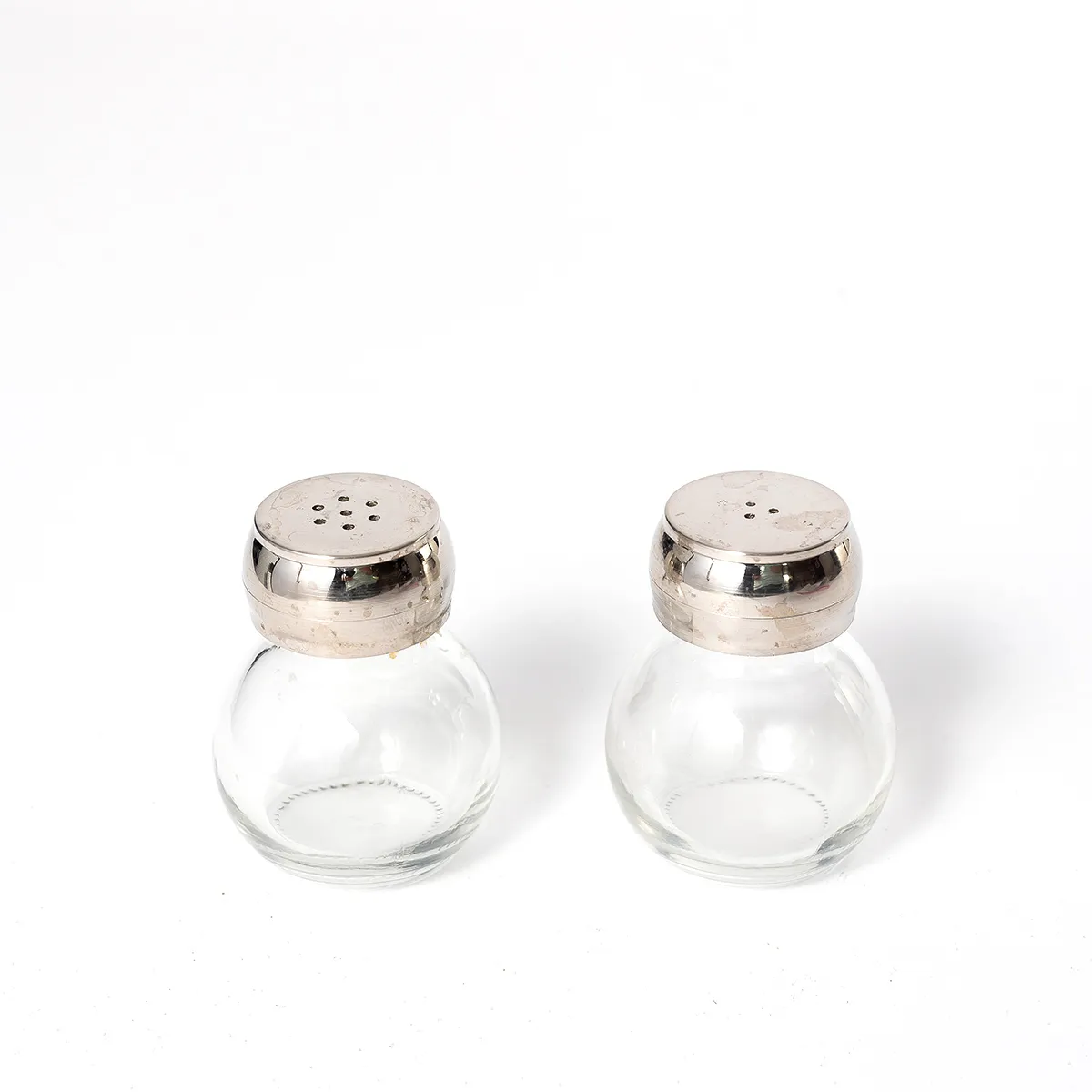 Clear Glass Round Salt and Pepper Shakers Shiny Chrome colored plastic Lids - 