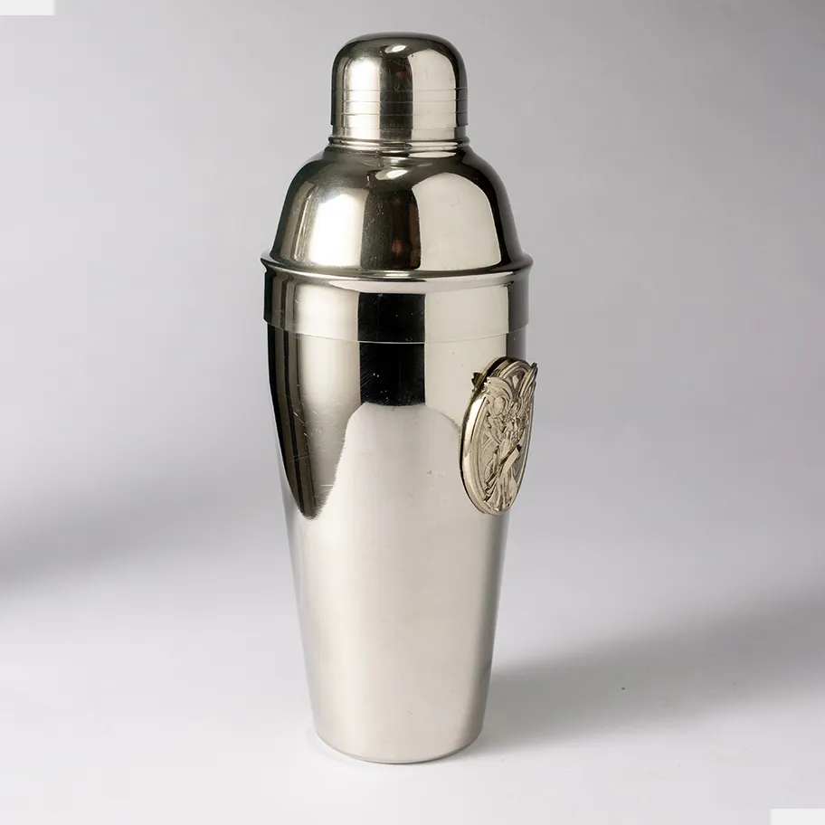 Silver Cocktail shaker with a winged woman emblem - 9.5" x 3.5"