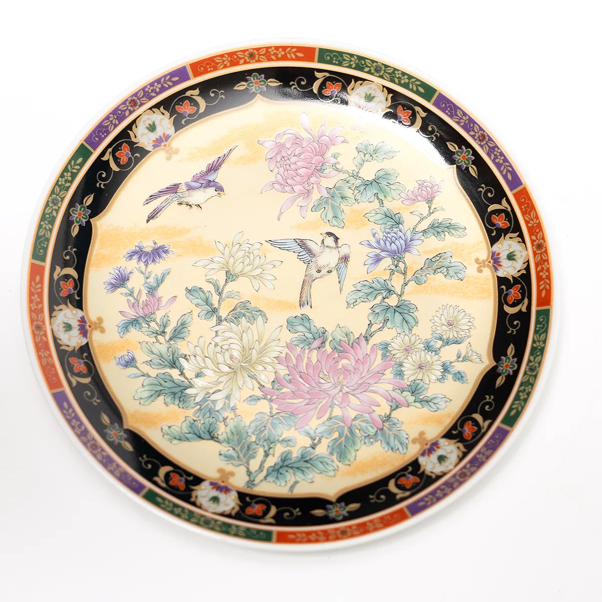 Vintage Japanese decorative porcelain plate featuring a hand-painted scene of birds and flowers