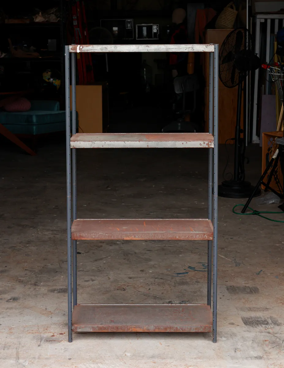 Vintage Metal Industrial Shelf Featuring a Four Shelves with a Weathered Rusty Patina