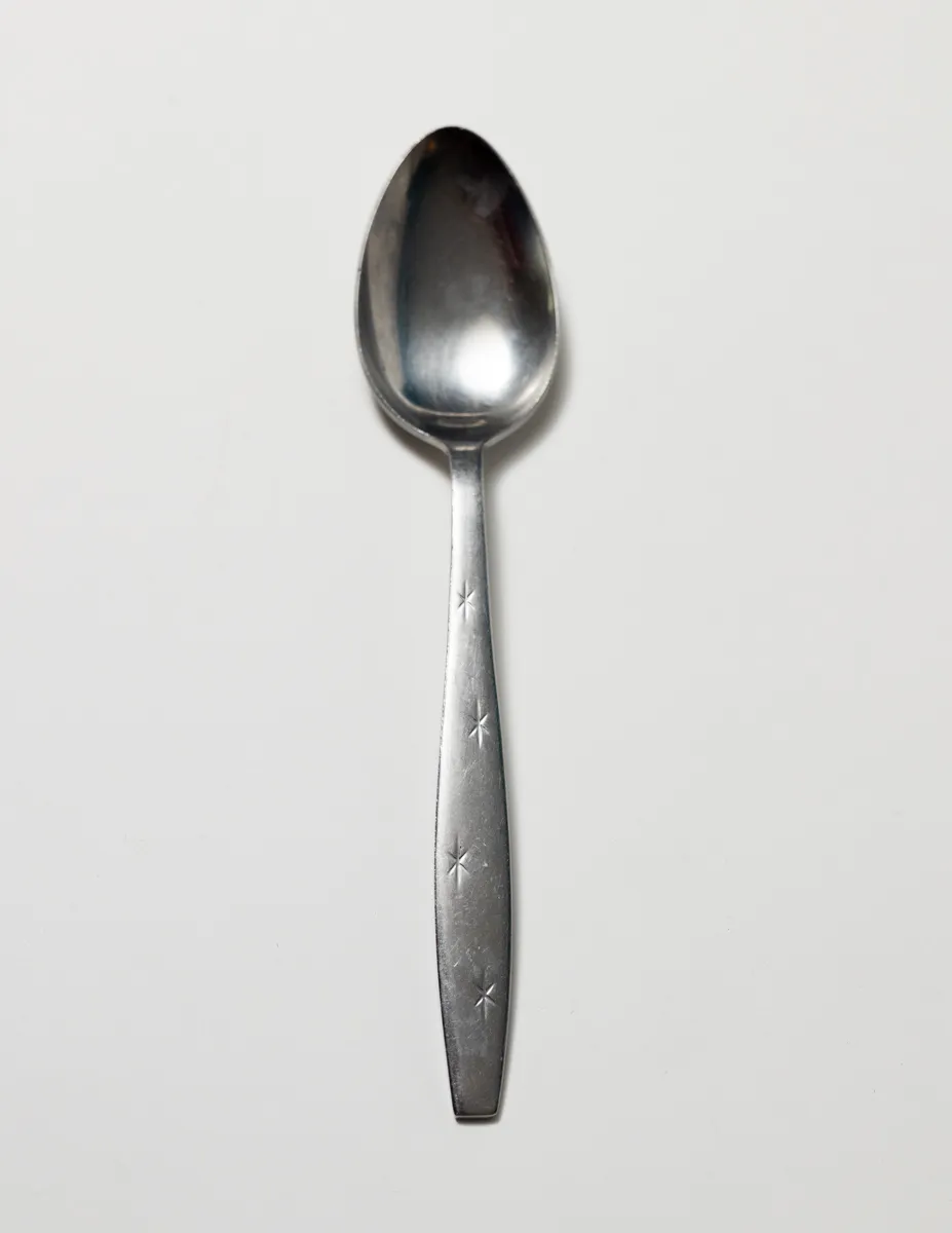 Flatware: Silver Serving Spoon with Pressed Stars in the handle
