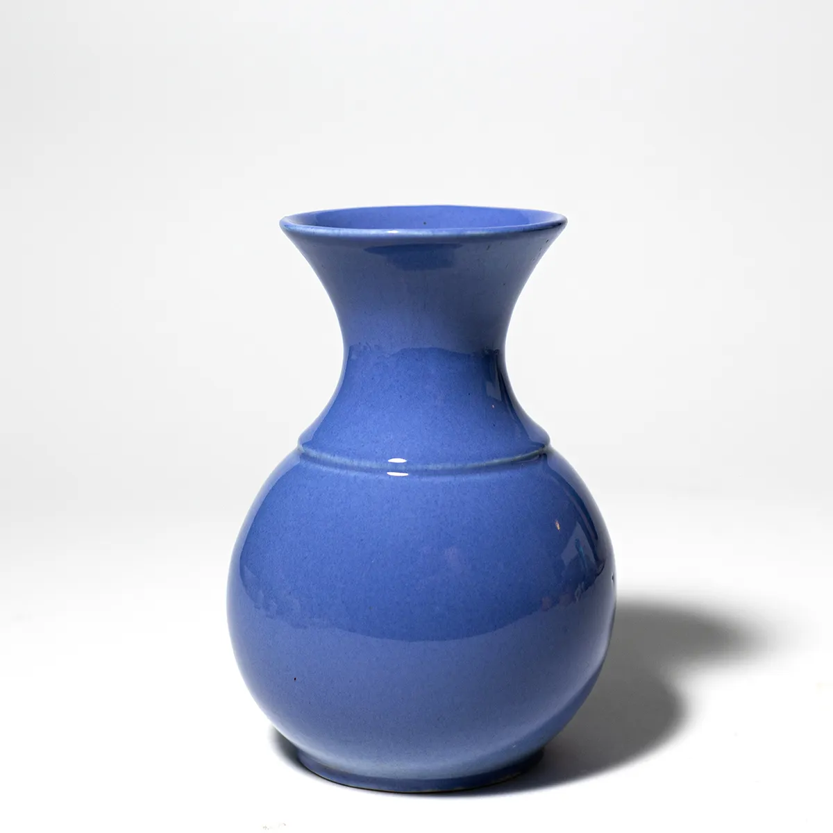 Periwinkle Hourglass shaped ceramic Flower Vase Wide Round Bulb at the bottom and Narrow at the top