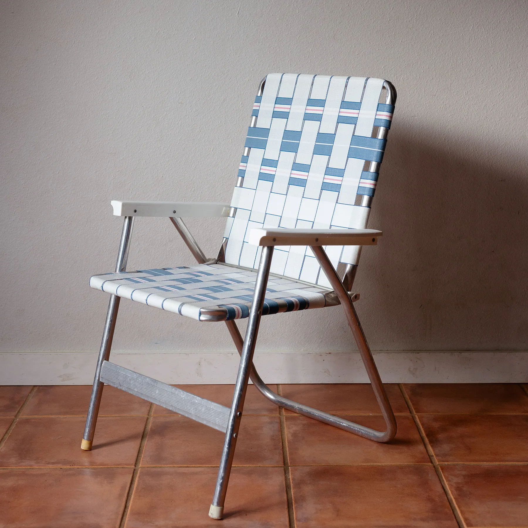 Blue and white woven lawn folding chair