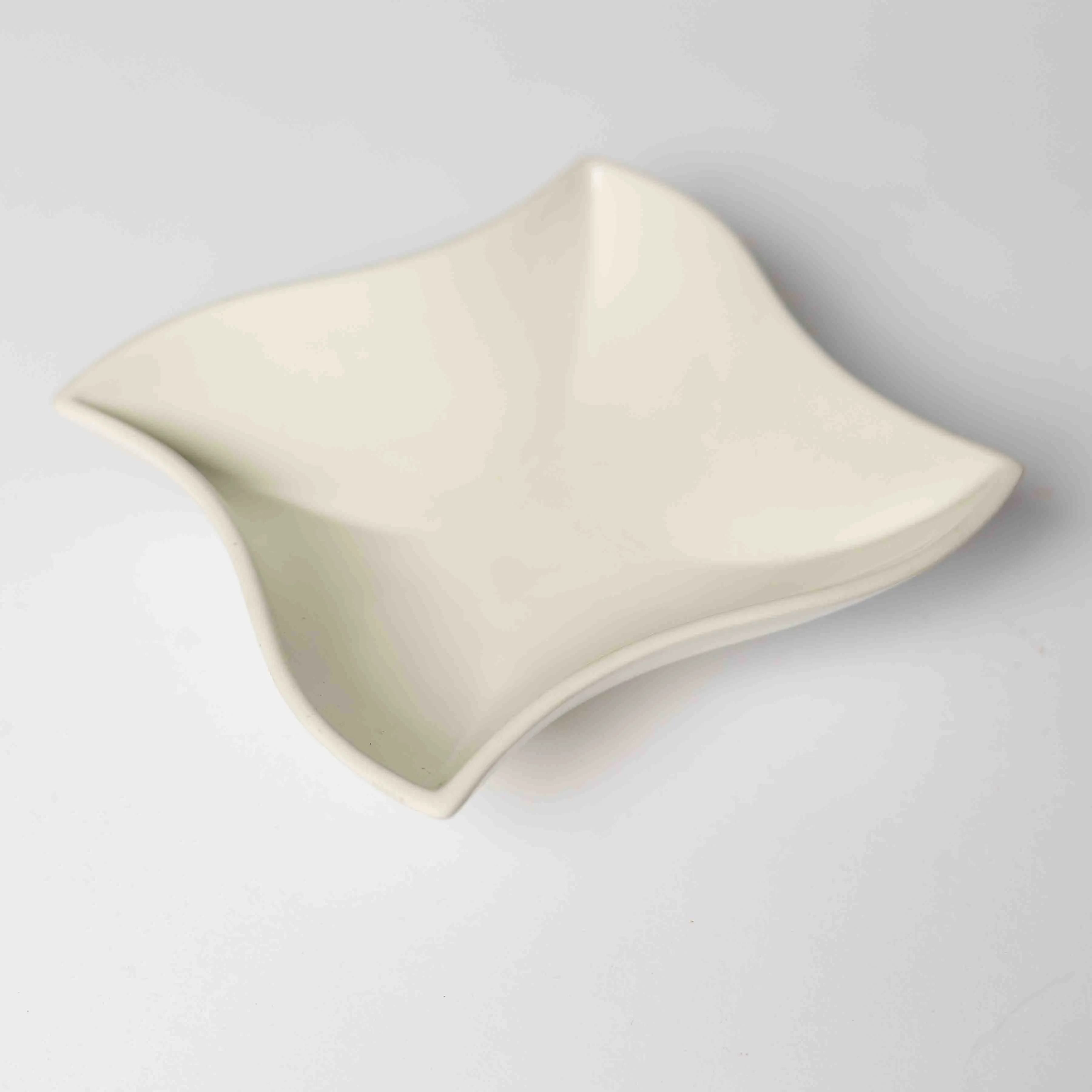Vintage Off White Ceramic Dish with pinched Corners and Wavy Edges Doubles as a Funky Riser