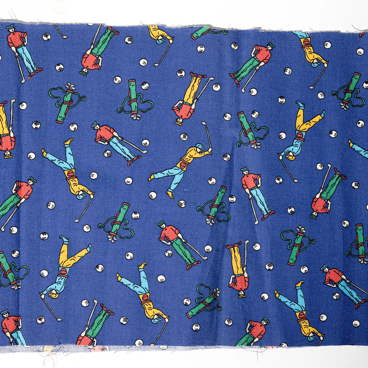 Royal Blue Purple Narrow Strip of Fabric with images of golfer and golf balls and Gold Bags