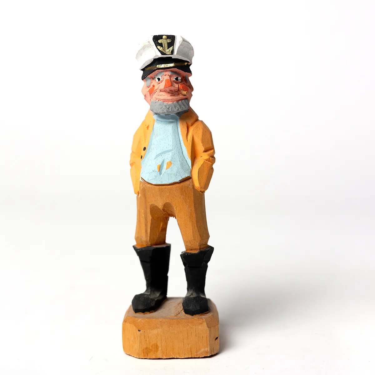 Hand Carved Ship Captain in a blue shirt and orange raincoat