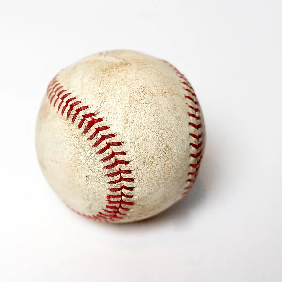 Used Softball White Leather Bound with Red Thread