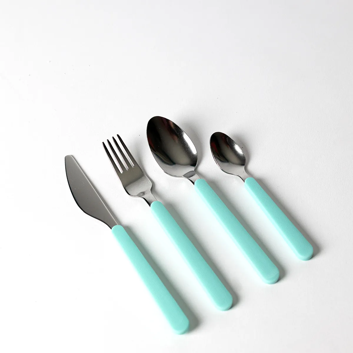 Silver Silverware with Tiffany Blue, Robbins egg Textured Plastic Handle from Ikea include butter knife, fork, spoon, and soup spoon