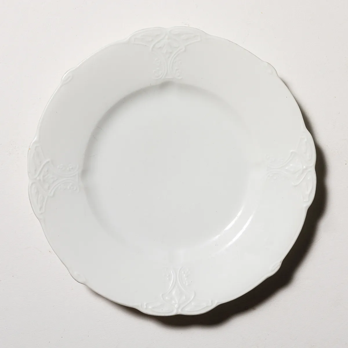 White Dessert Plate with Detailed Edge Embossed Detail an Scalloped edge
