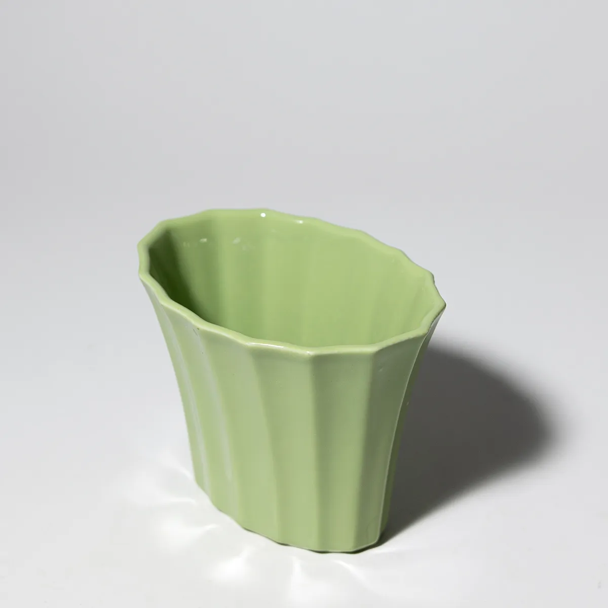 Melon Green Oval Ceramic Flower Vast with Ribbing and a Wide Opening at the Top