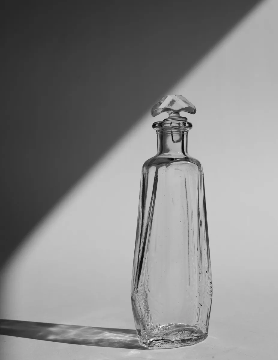 Vintage Art Deco clear glass perfume or cologne bottle