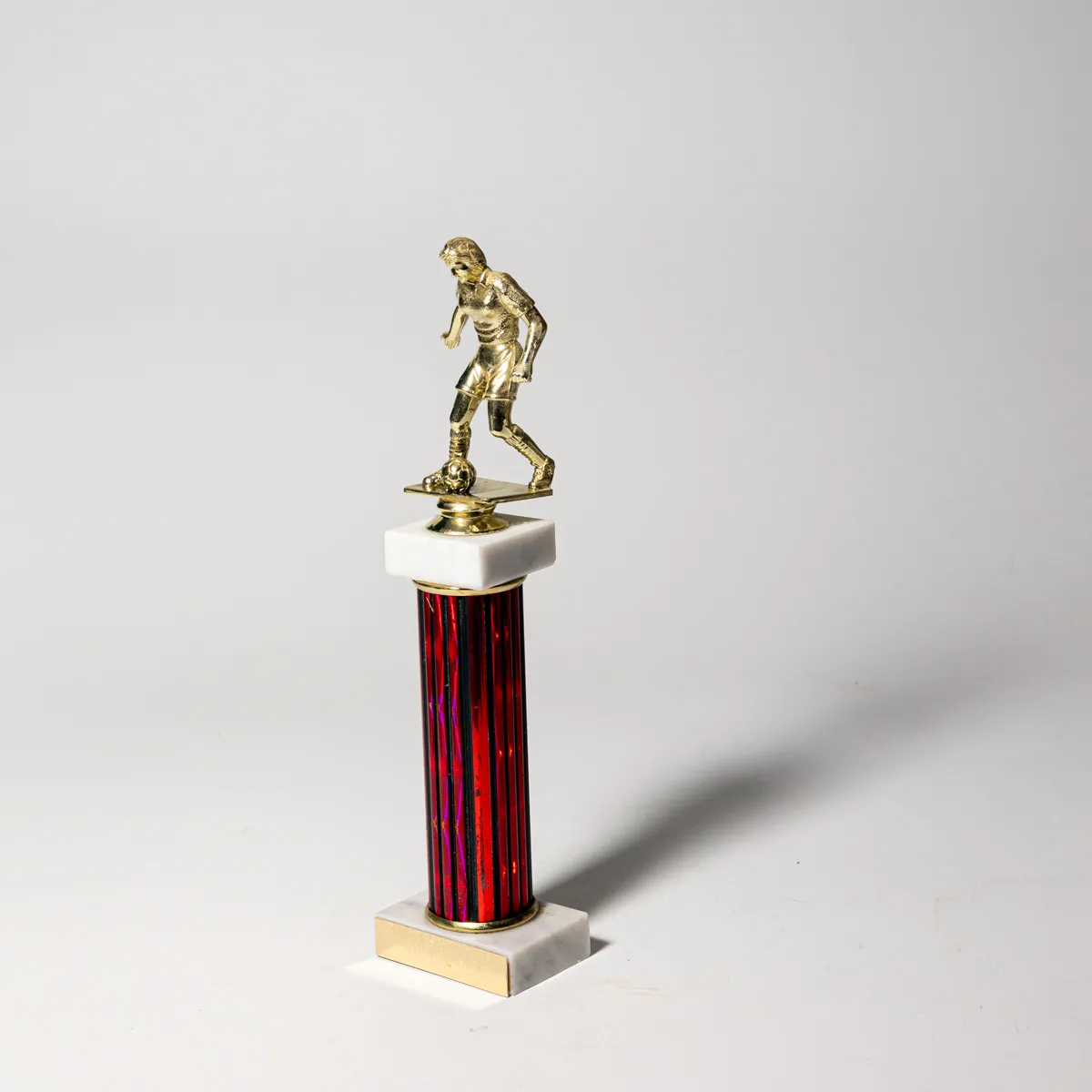 Vintage White Marble Red and Black Plastic Junior Soccer Trophy