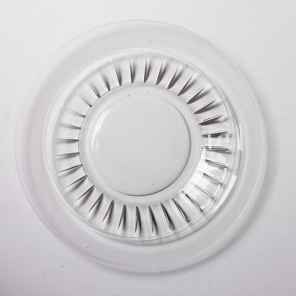 Clear Pressed Glass Plain Flat Center with striped indentions near the edge.
