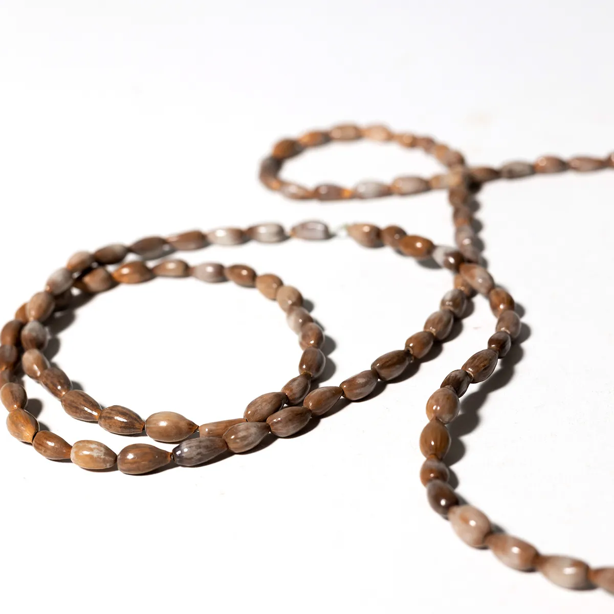 necklace made of small brown seashells Hawaian