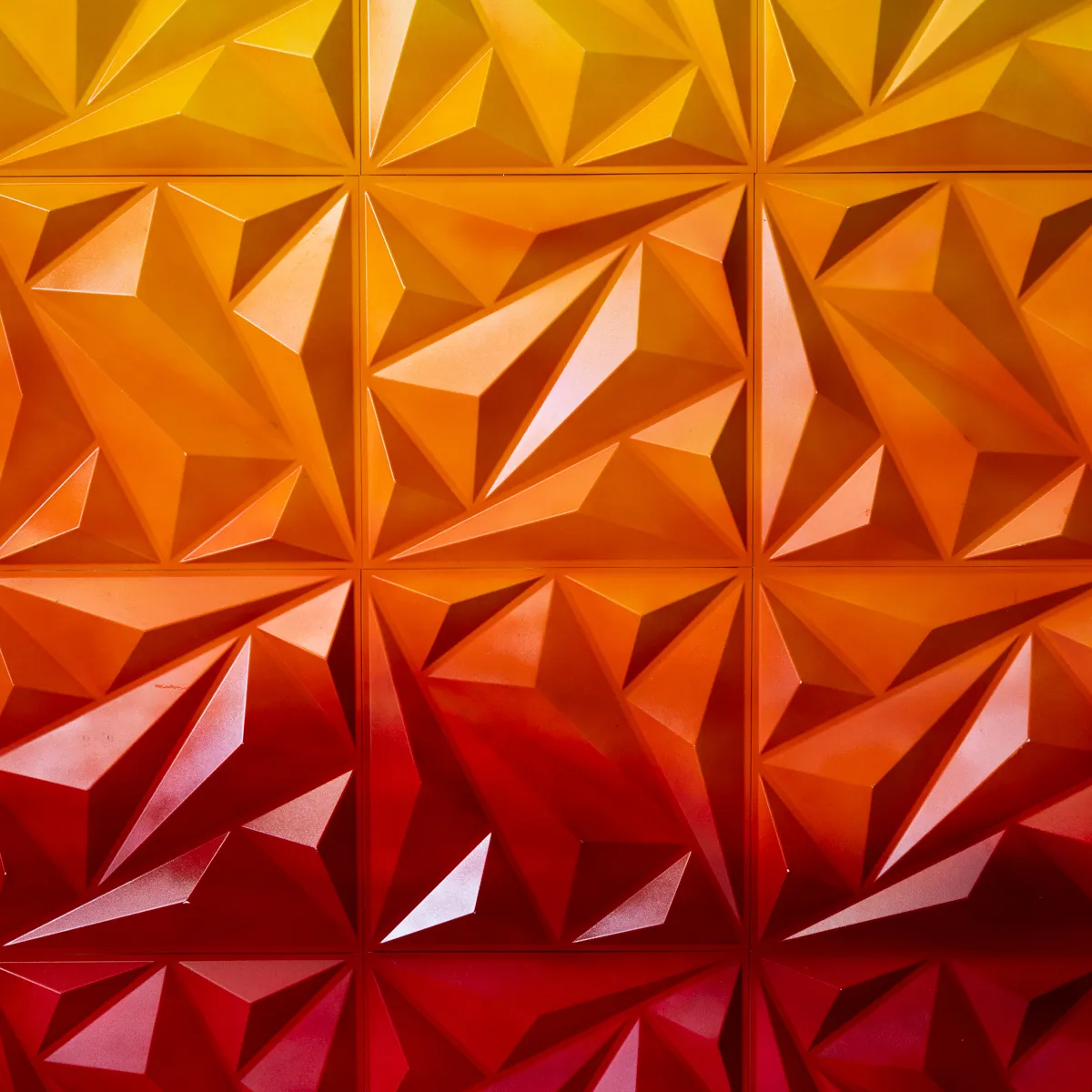 Yellow to red ombre wall hanging backdrop. Textured, angular