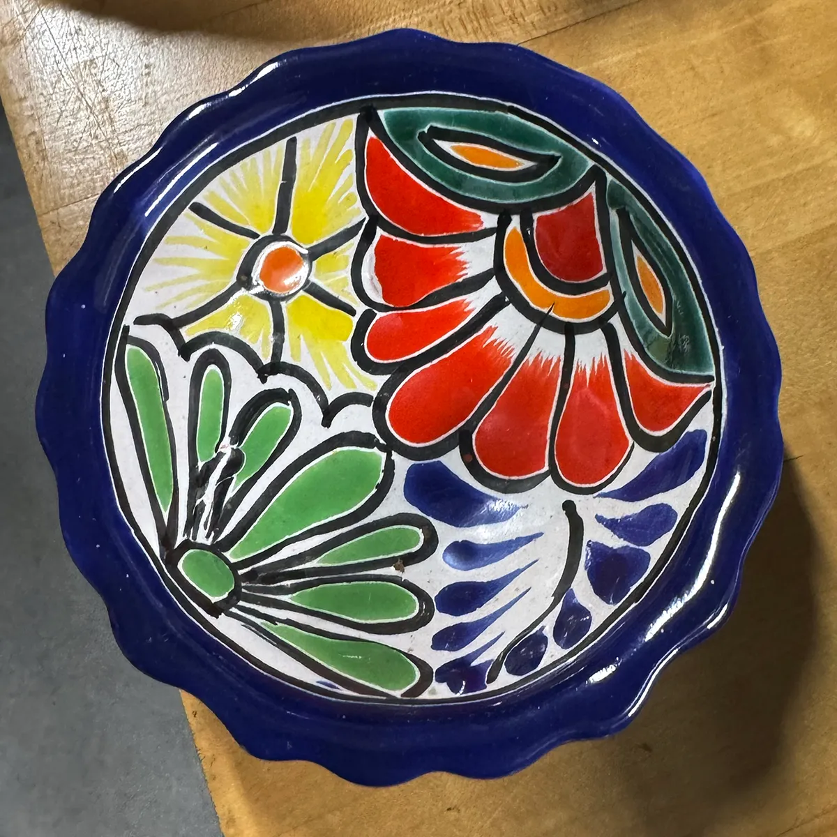 Hand-painted Mexican pottery bowl, typically identified as Talavera ware