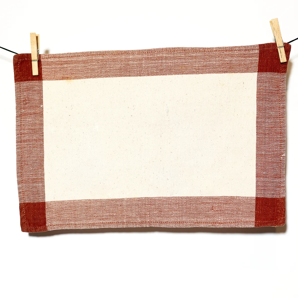 Kitchen Soft Goods: Off White Cotton Rectangle Placemat with Rust Brown Edging Overlapping at the Corners - 17.5" x 11"