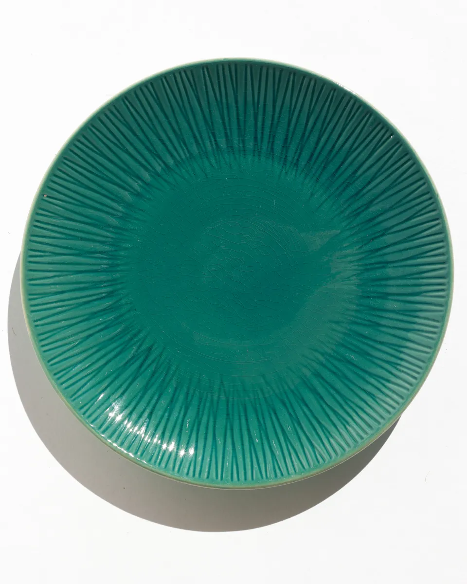 Dinner Plate Asha Green with textured lines radiating from the center 