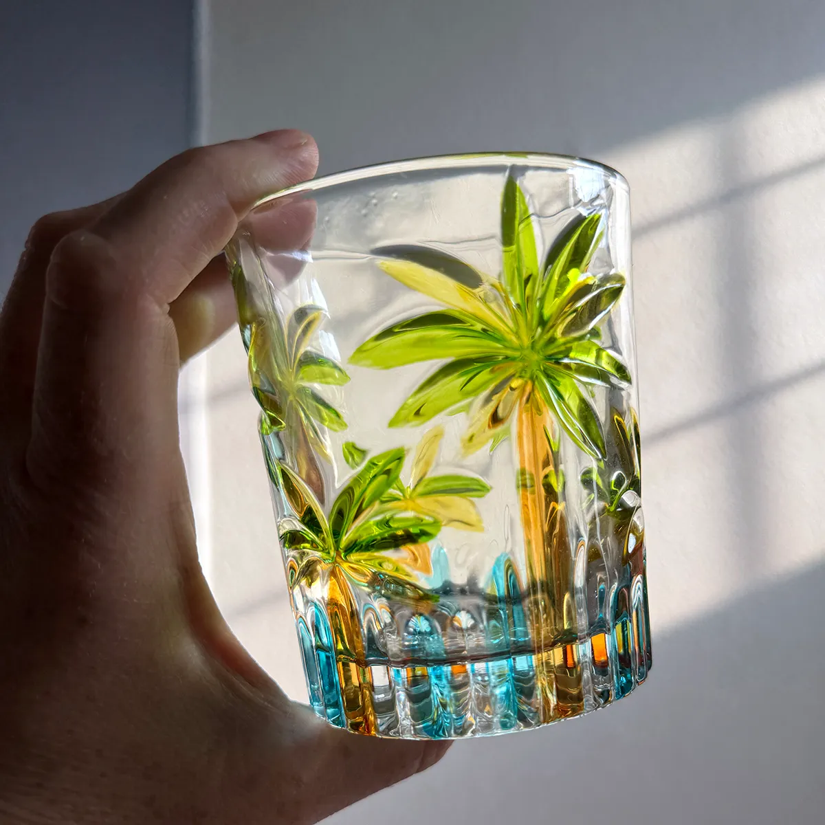 Round, Rocks Glass with Tropical look, Palm Frond shaped Pressed Glass and colored in various shades of green and yellow