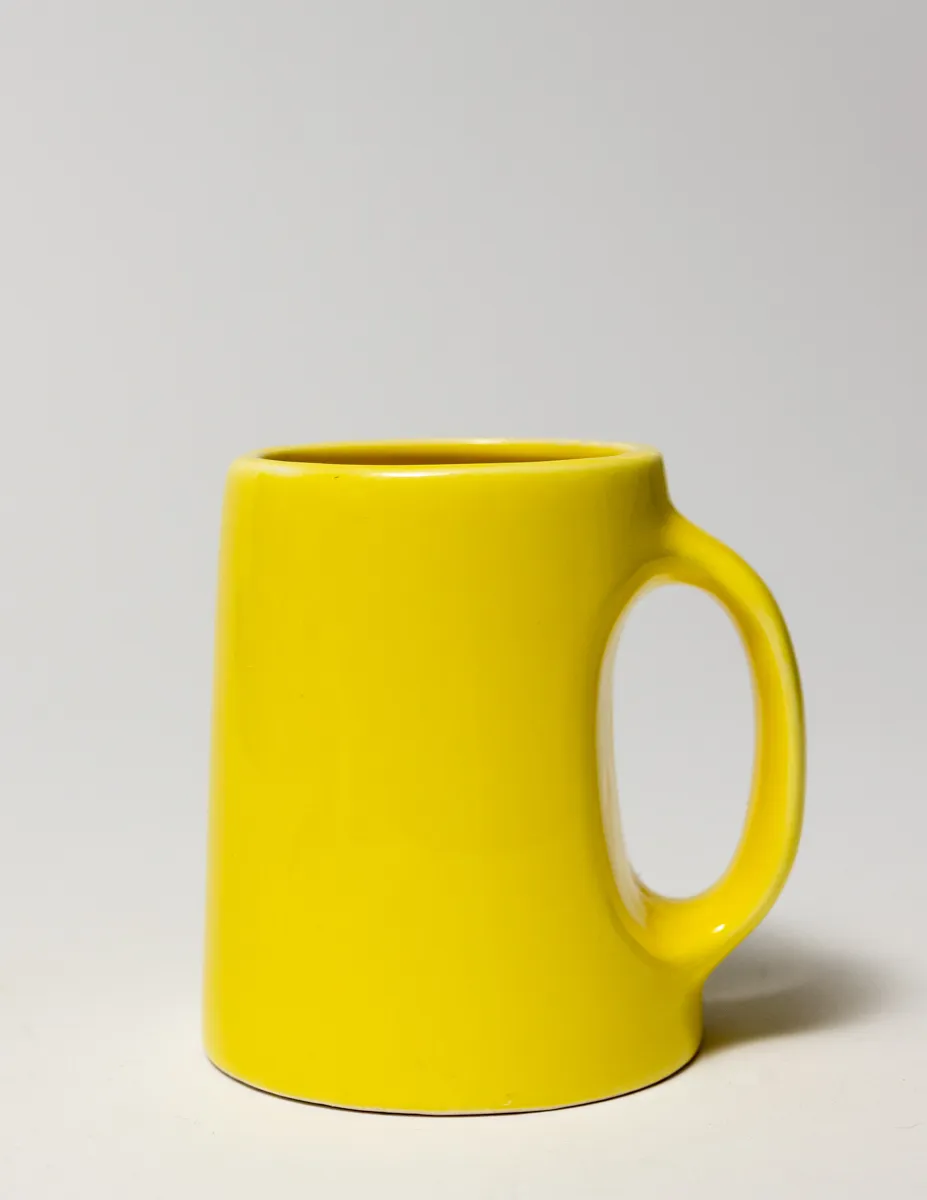 Unique Yellow Ceramic Coffee Cup with Handles incorporated into the mug