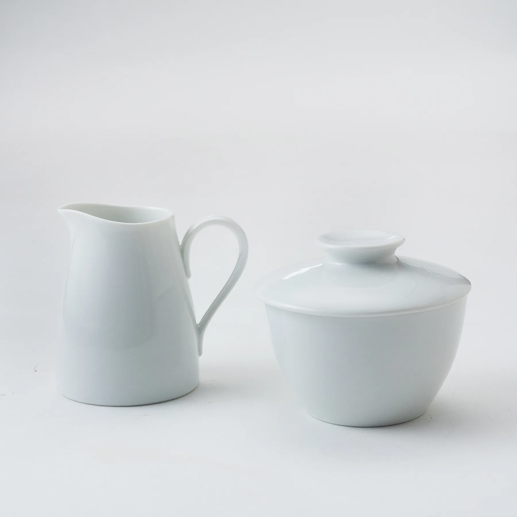 White china cream & sugar bowl set - pitcher 3.75" x 3" & sugar 3.5" x 4"