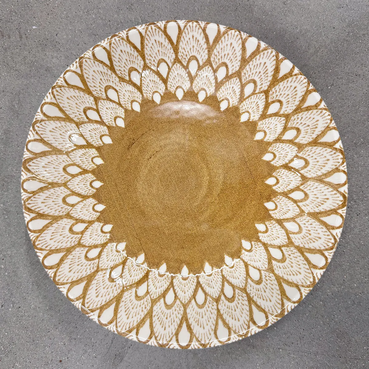 Wide Oversized Bowl, with a detailed pattern resembling peacock feathers or tear-drops, in white outlined with the same gold/brown color