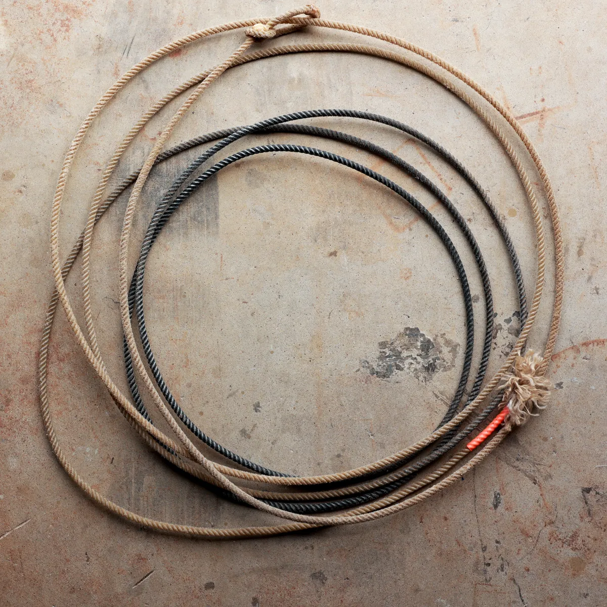 worn western lasso rope frayed tan black