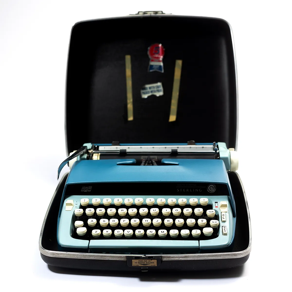 Vintage two tone blue working typewriter in a hard case - 13" x 13" x 5"