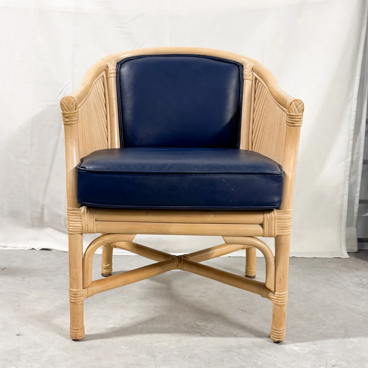 Natural Rattan Barrel Back Dining Chair with Navy Blue Vinyl seat cushion and seat back