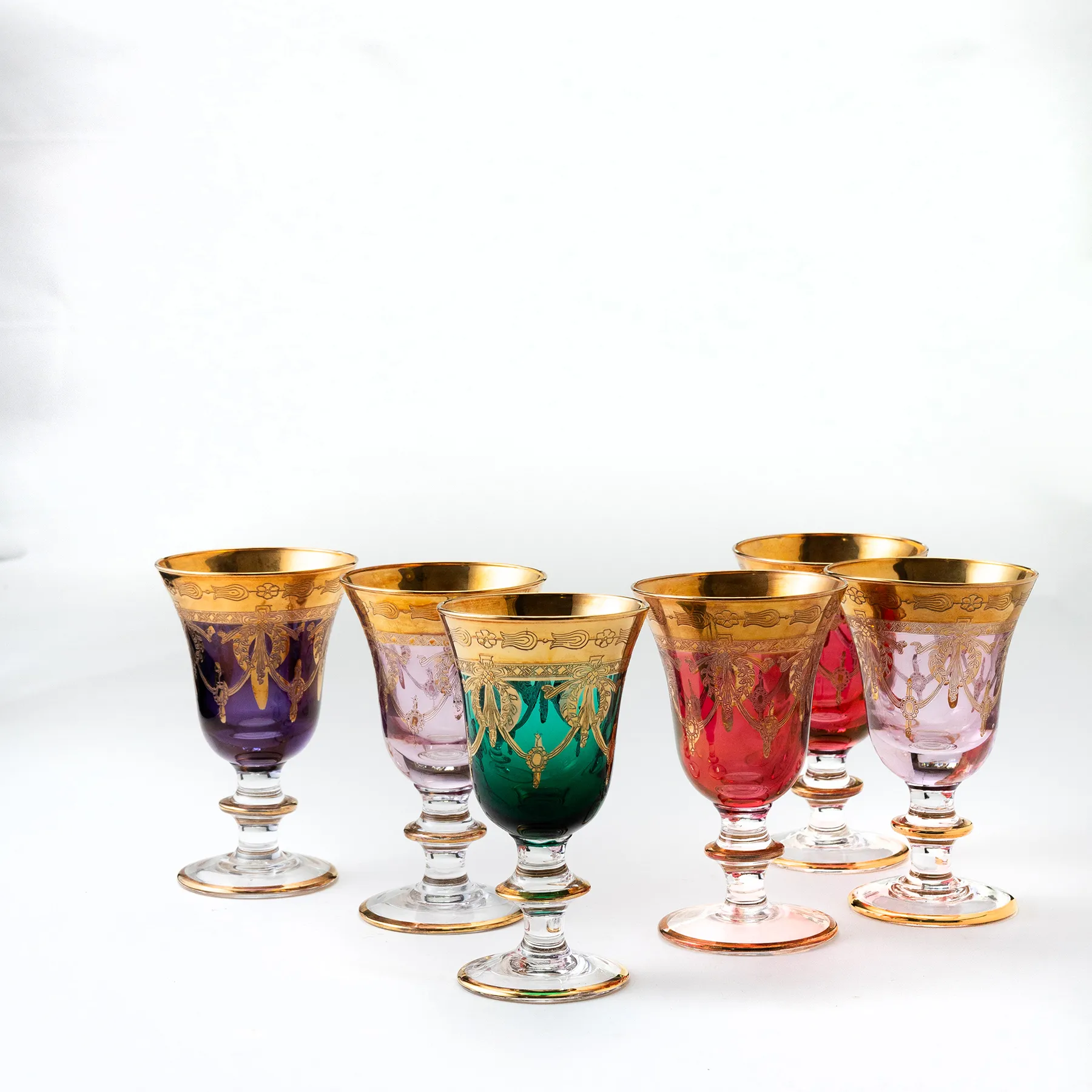 Glass jewel toned goblets trimmed in gold, 2 light purple, 1 dark purple, 2 red, 1 green - 6" x 3.5"