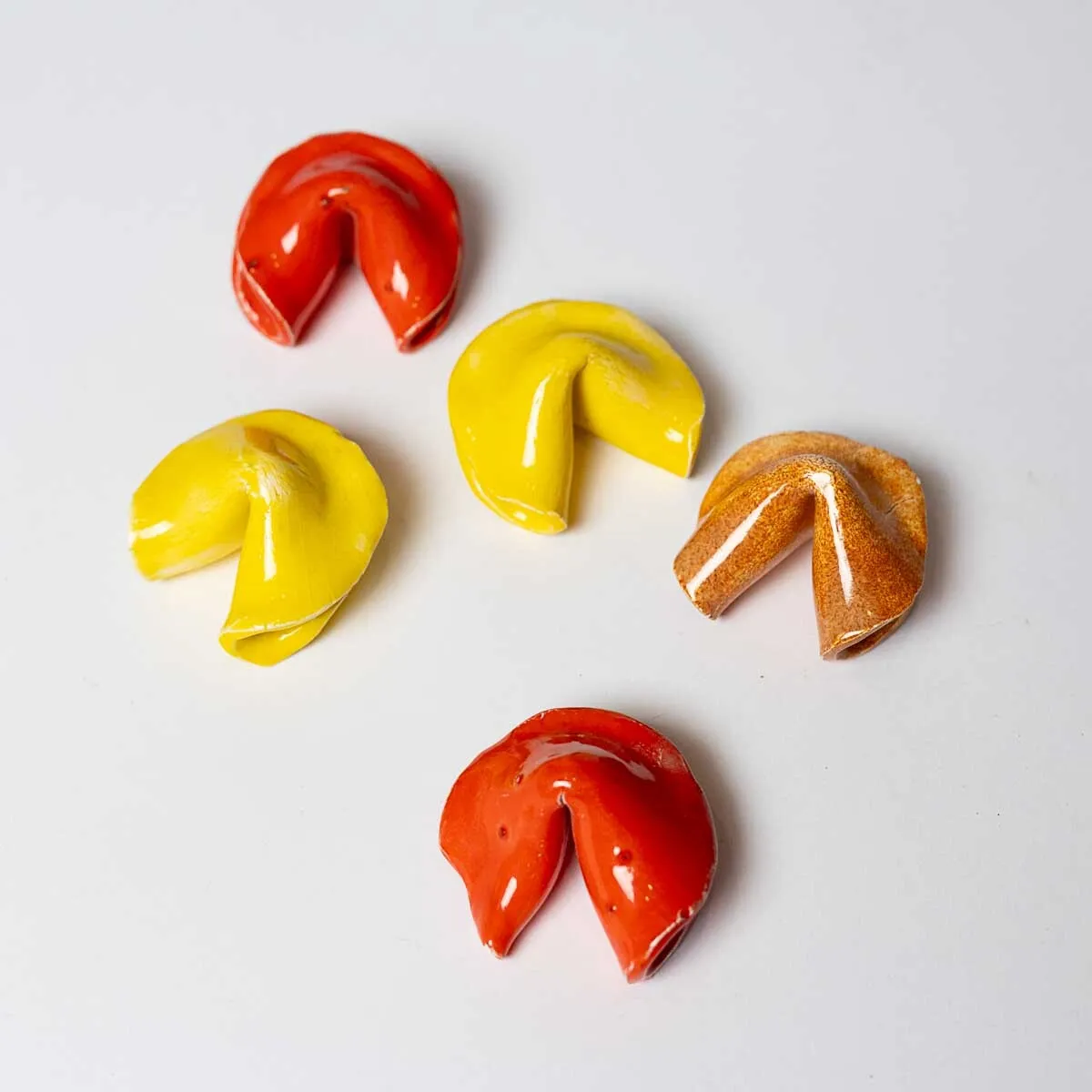 Handmade, Ceramic Reusable Fortune Cookies 2 red, 2 yellow, 1 terracotta - roughly 2" x 2"