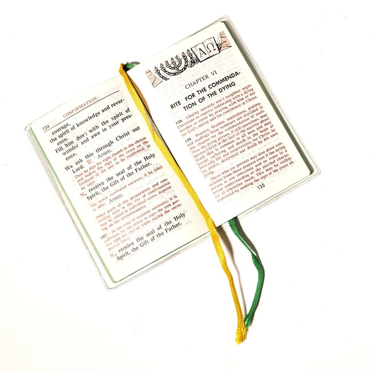 Book: Rite of Anointing and Pastoral Care of the Sick, Small PLastic covered book with a biird in flight and a gren and yellow ribbon place holders