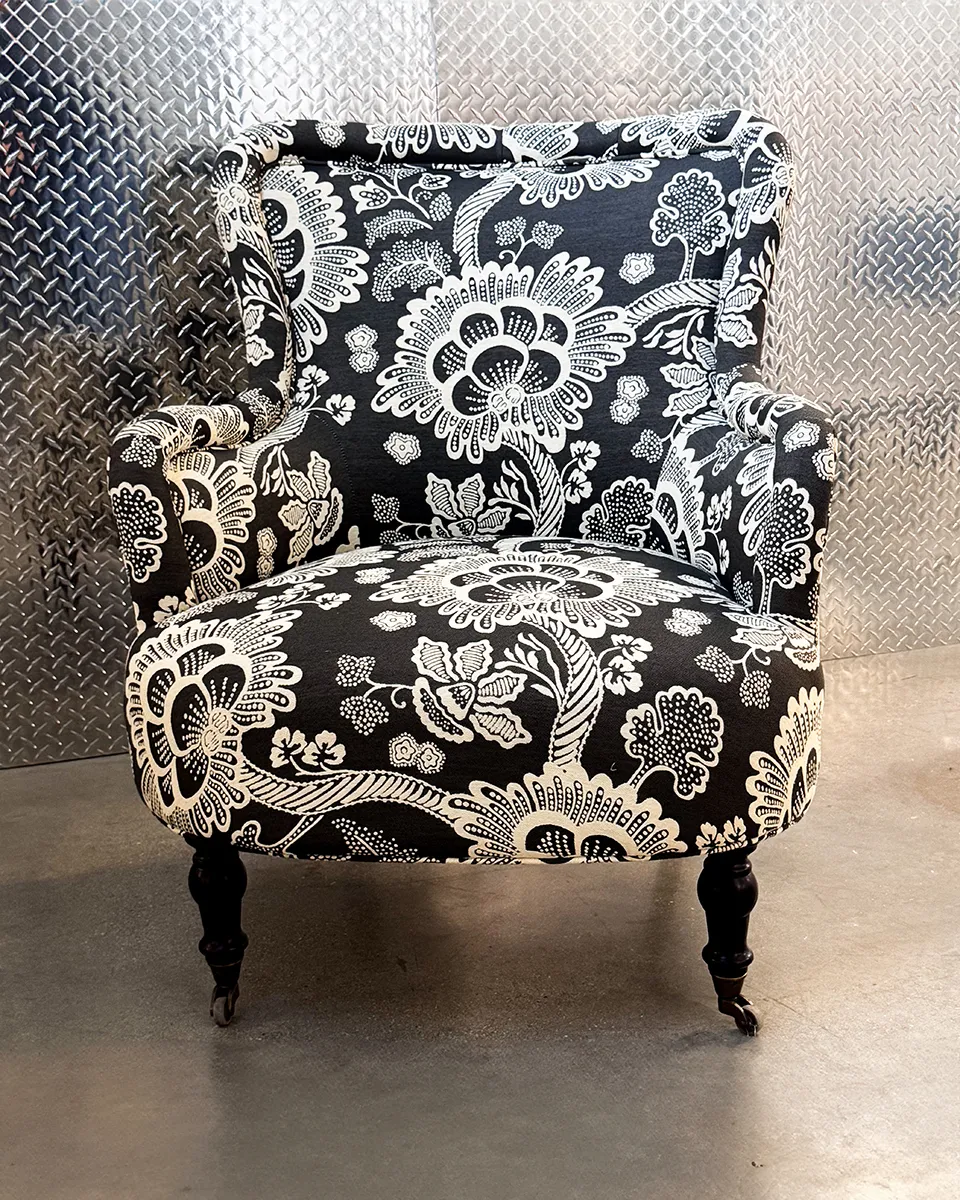 Black and White Floral Print Wingback Accent Chair with Dark Wood Legs and Casters