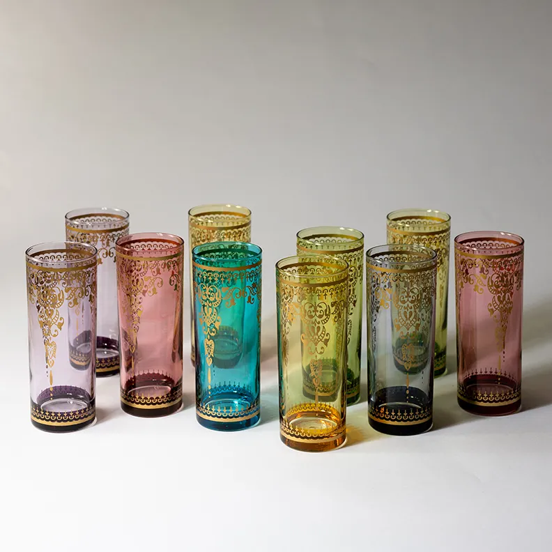 Gold Moroccan Detail jewel toned highball glasses. 2 pink, 2 yellow, 2 purple, 2 green, 1 blue, 1 gray - 6.25" x 2.5"